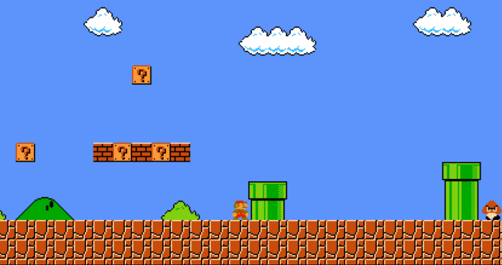 A screenshot of the video game Super Mario Bros., World 1-1. In it, small Mario is standing to the left of a green pipe, with a cluster of blocks hanging in the air behind him. Beyond the first green pipe is a second, taller pipe, and a Goomba (a kind of walking mushroom wearing a scowl) appears to be approaching that pipe from just off screen.