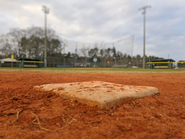 A photograph of a second base from close to ground level, looking back toward home plate